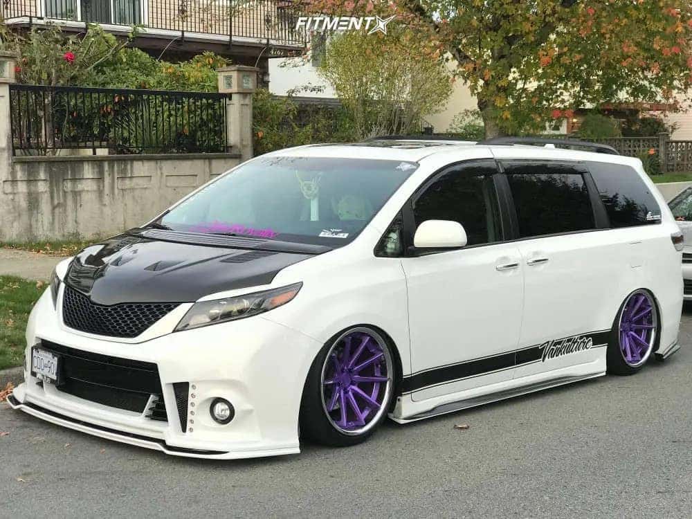 White minivan with lowered suspension and purple wheels