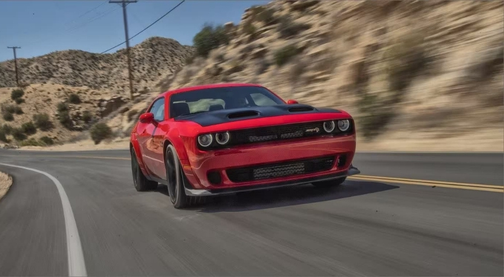 Red 2023 Dodge Challenger SRT is shown after looking at used cars for sale near Bloomfield