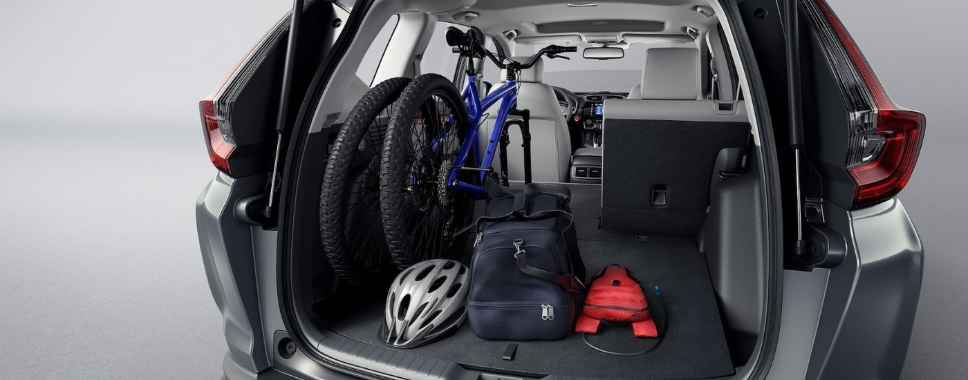 Biking gear in the trunk of a grey 2021 Honda CR-V