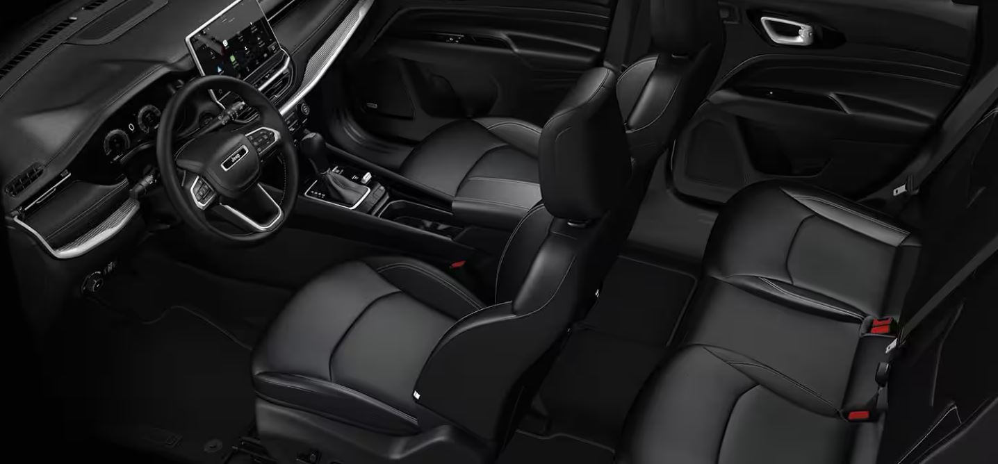 Overhead shot of the 2024 Jeep Compass interior, displaying premium leather-trimmed seats and spacious cabin layout for ultimate comfort.