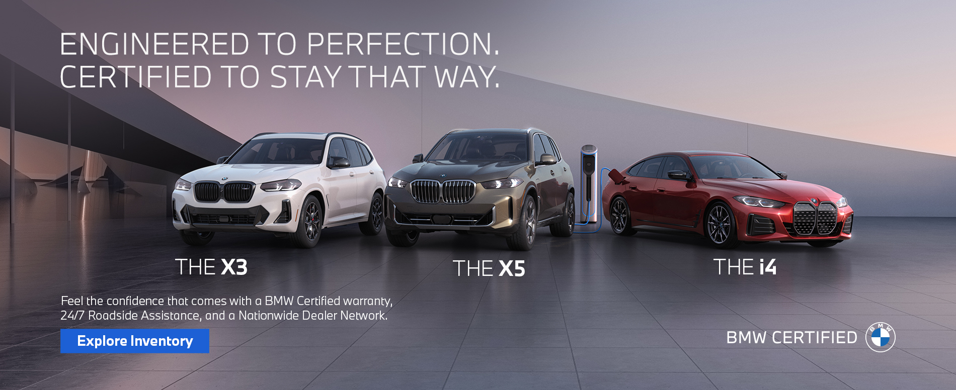 BMW Certified X3, X5, and i4 parked on a modern rooftop at sunrise.