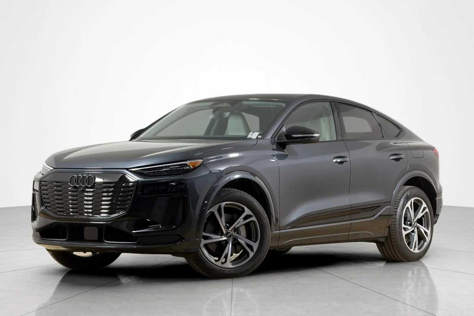 2027 Audi Q6 Sportback e-tron in dark gray, side profile studio view