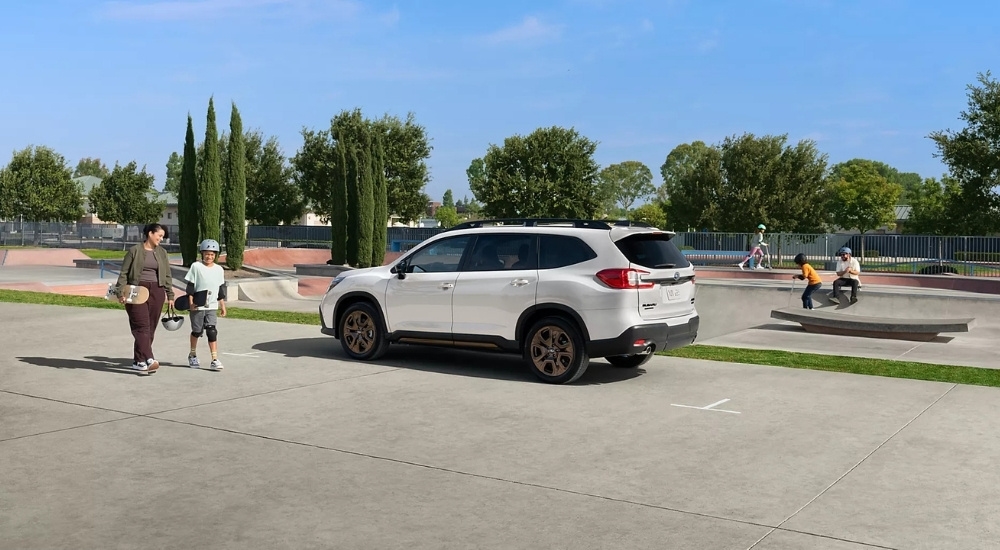 A white 2025 Subaru Ascent Bronze Edition parked at a skate park.