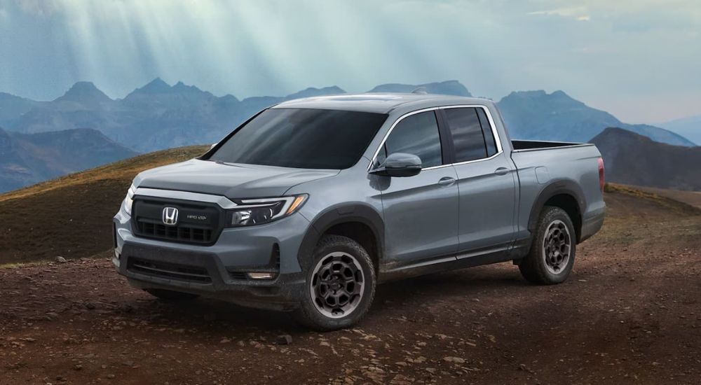 Grey 2024 Honda Ridgeline RTL HPD+ parked off-road.