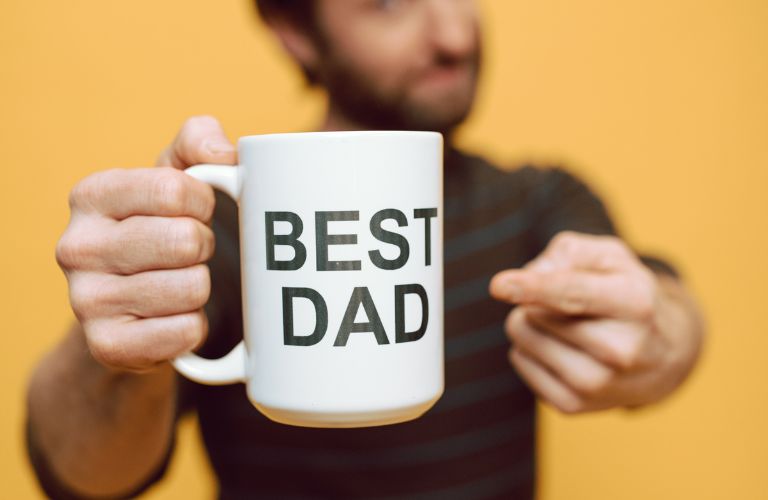Dad Holding Best Dad Coffee Mug
