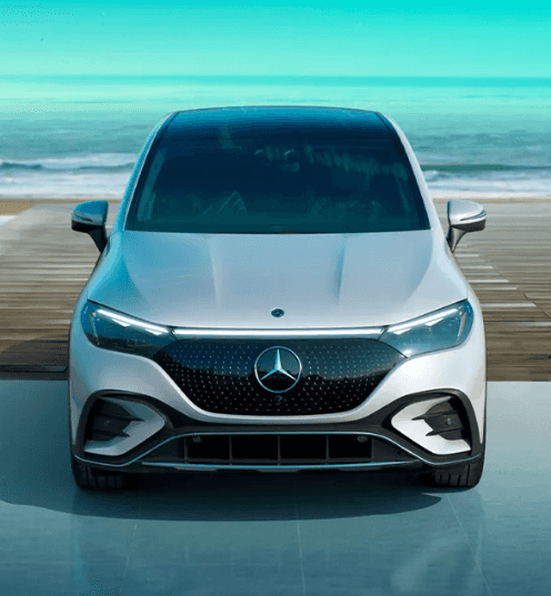 A front look of the Mercedes AMG EQE SUV parked by the beach.