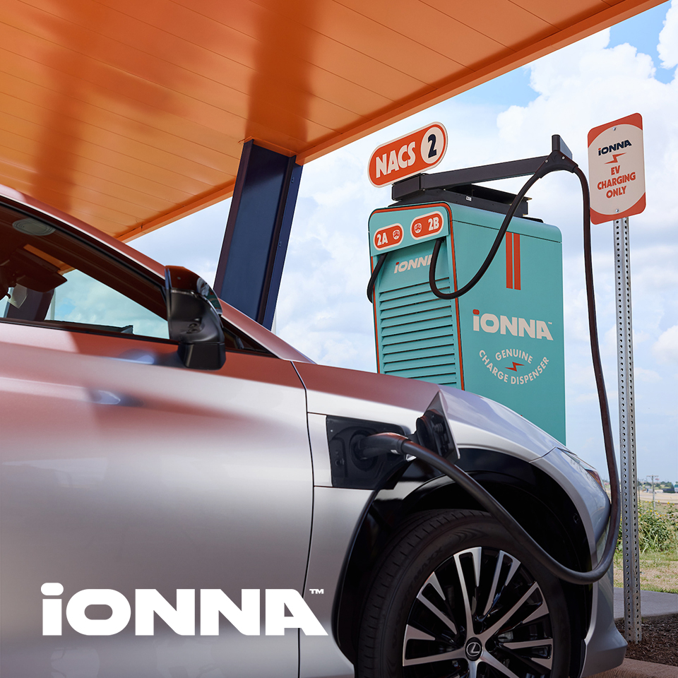 An electric car plugged into an IONNA charging station. 