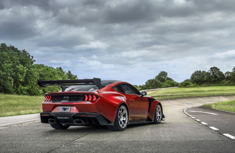 Red and Black 2025 Ford Mustang GTD Carbon Series Rear Exterior on a Track