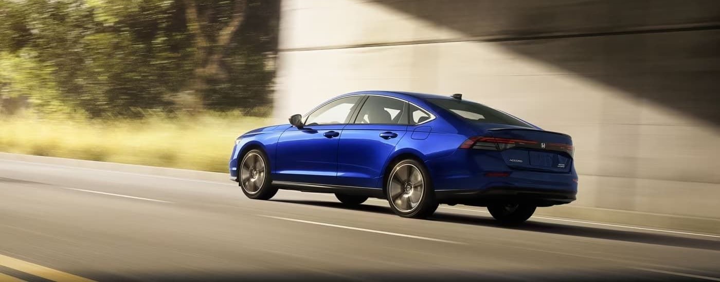 Blue 2025 Honda Accord Sport Touring driving under an overpass