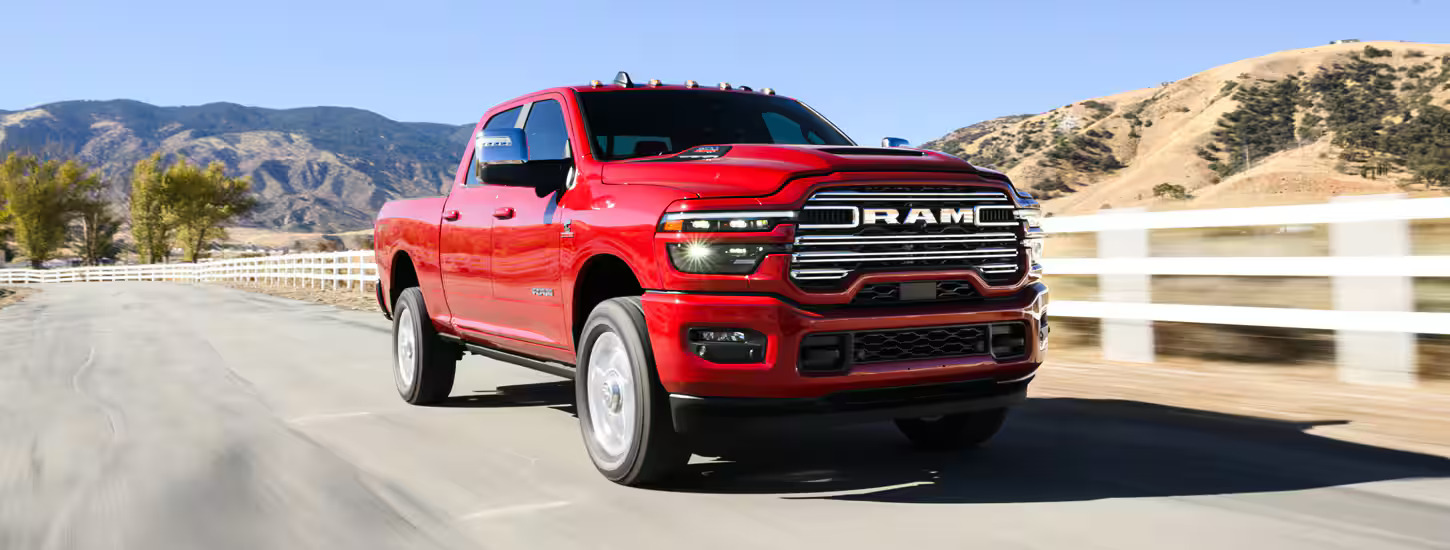 A red truck driving on the road.