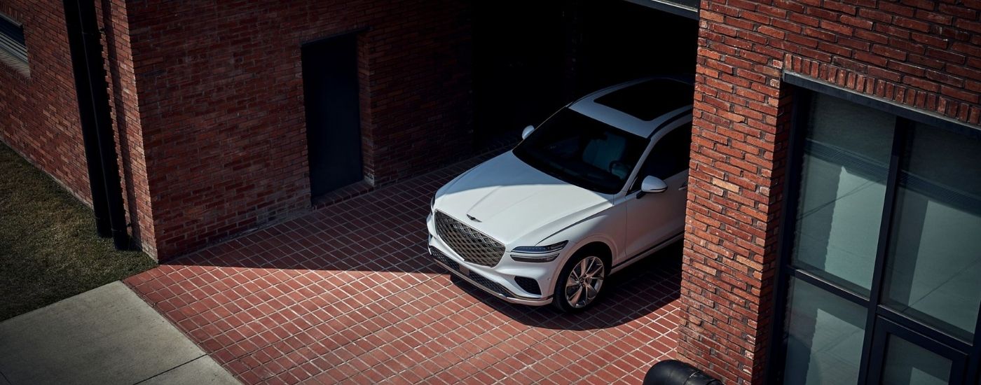White 2026 2026 Genesis GV70 parked in an alley