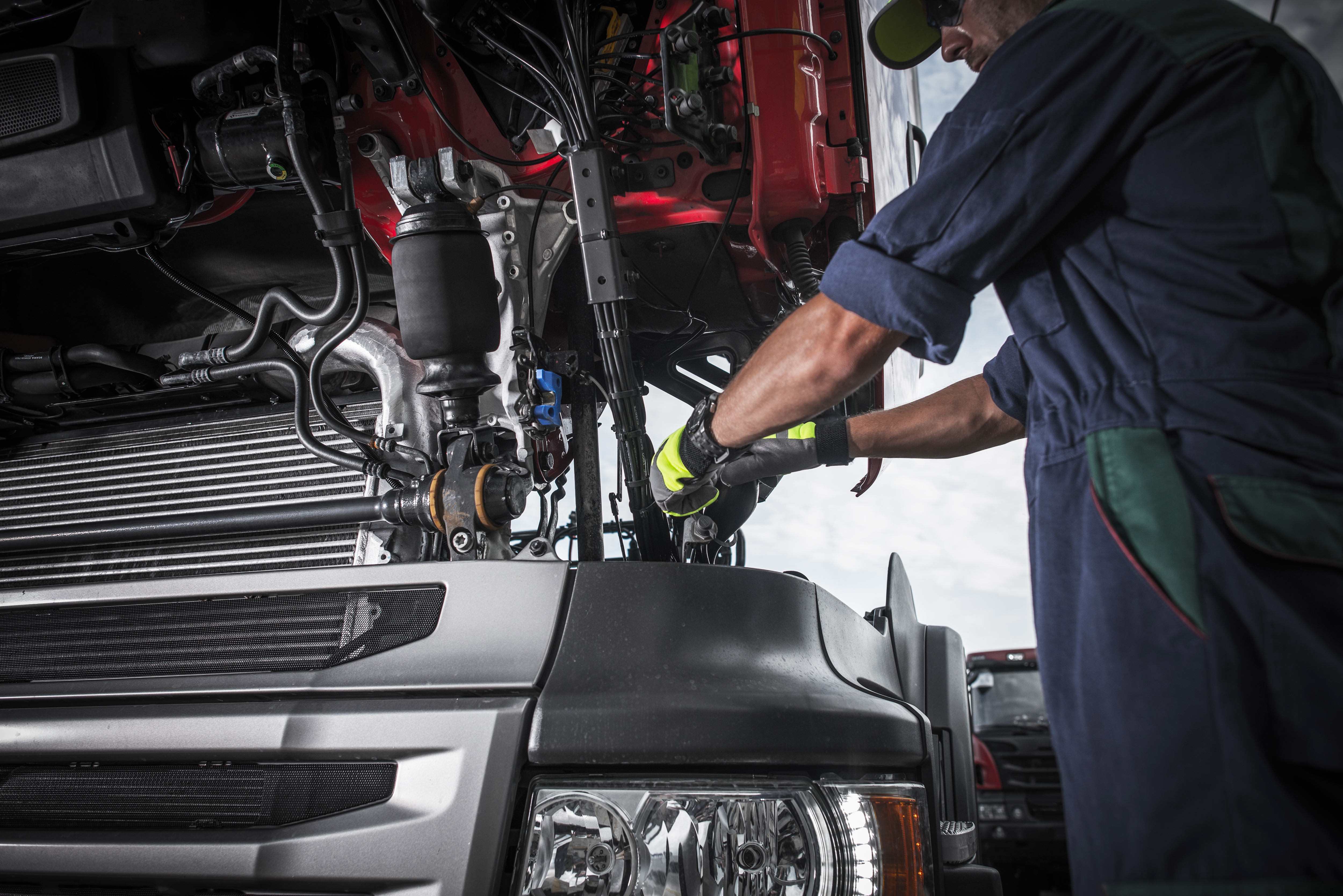 alt="Certified diesel technician performing engine diagnostics on a Ford Super Duty at Don Hattan in Wichita, KS"