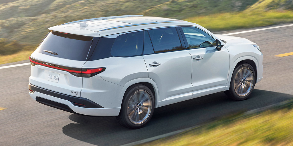 right side view of the 2024 Lexus TX driving on highway