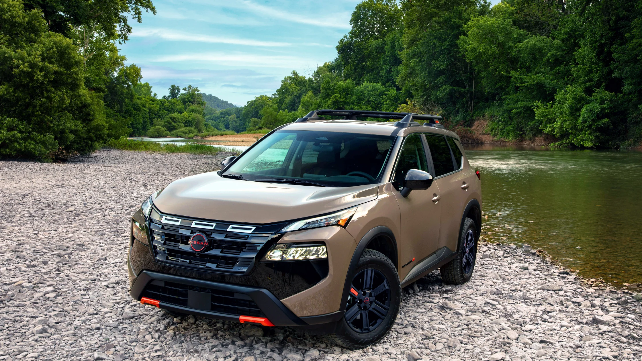 2026 Nissan Rogue® parked by riverbank