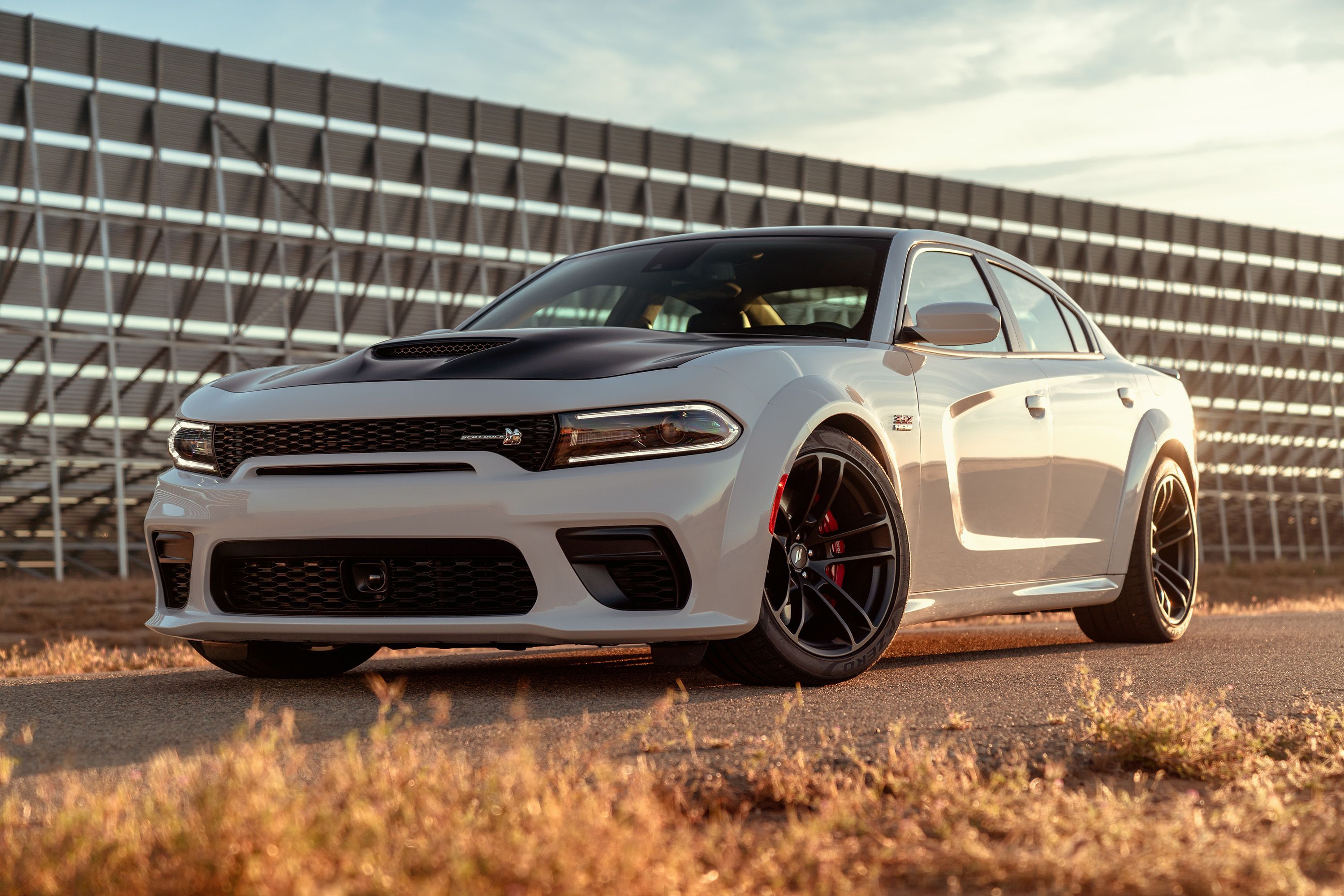 A white 2020 Dodge Charger parked. 