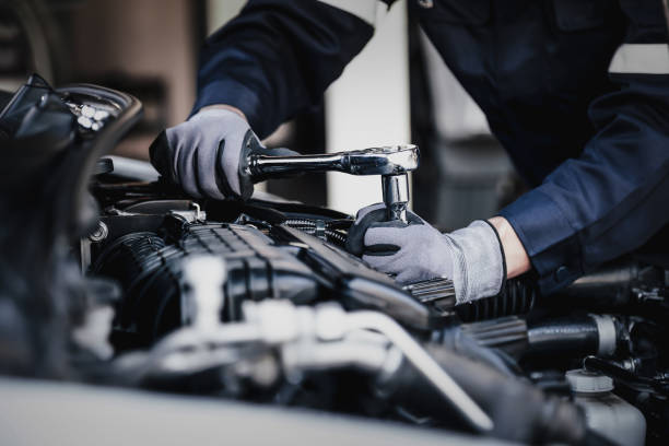 service technician working on a car