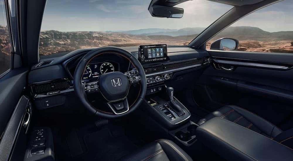 The black interior of a 2025 Honda CR-V Hybrid."