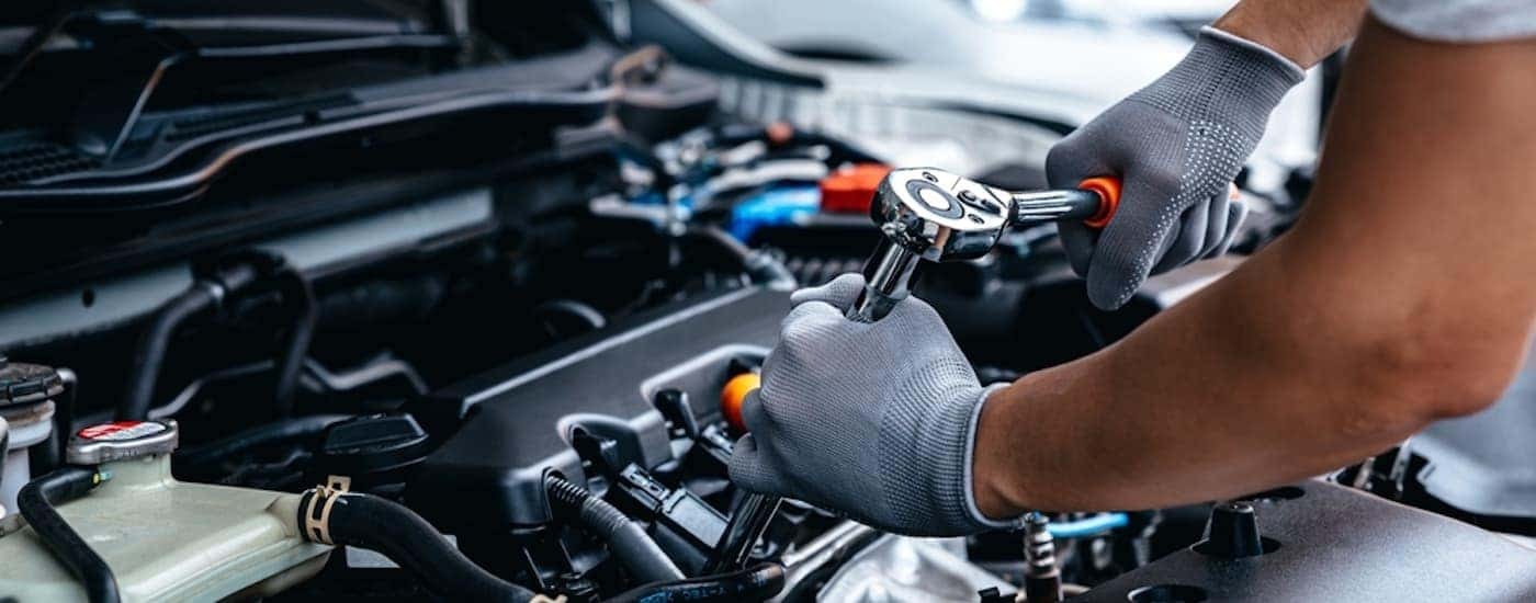 A mechanic working on an engine.