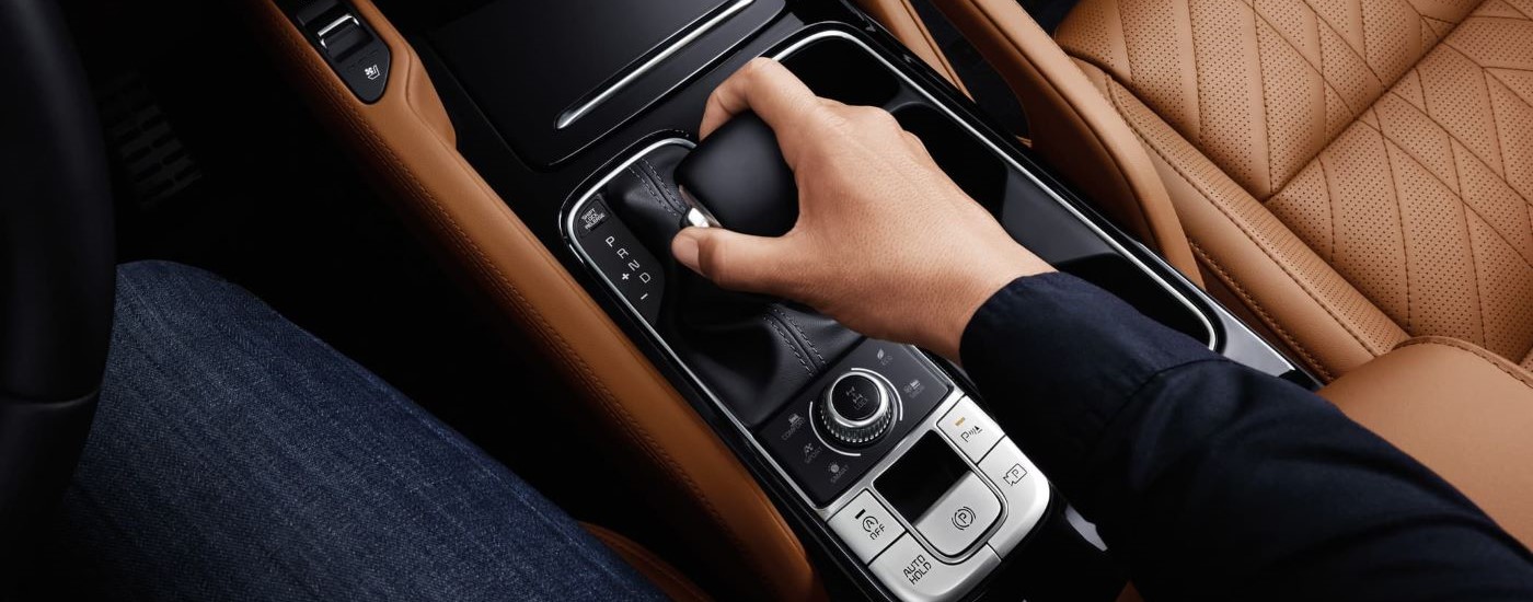 Person using the shifter in a 2025 Kia Telluride X-Pro for sale