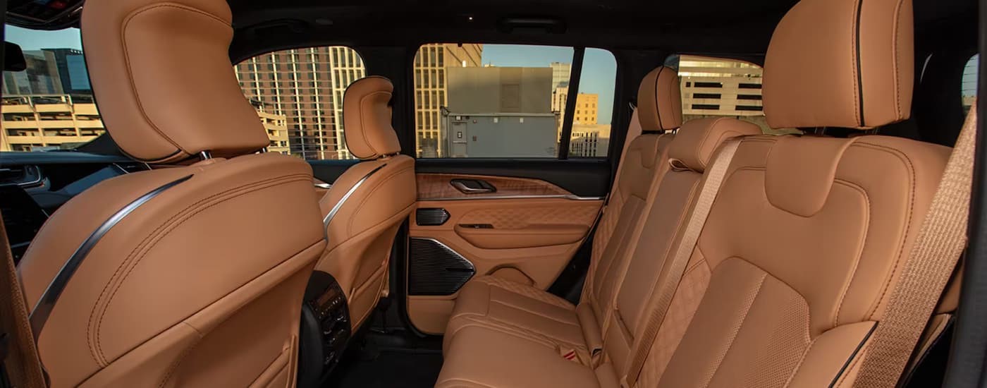 The brown interior and rear seating in a 2024 Jeep Grand Cherokee Summit Reserve.