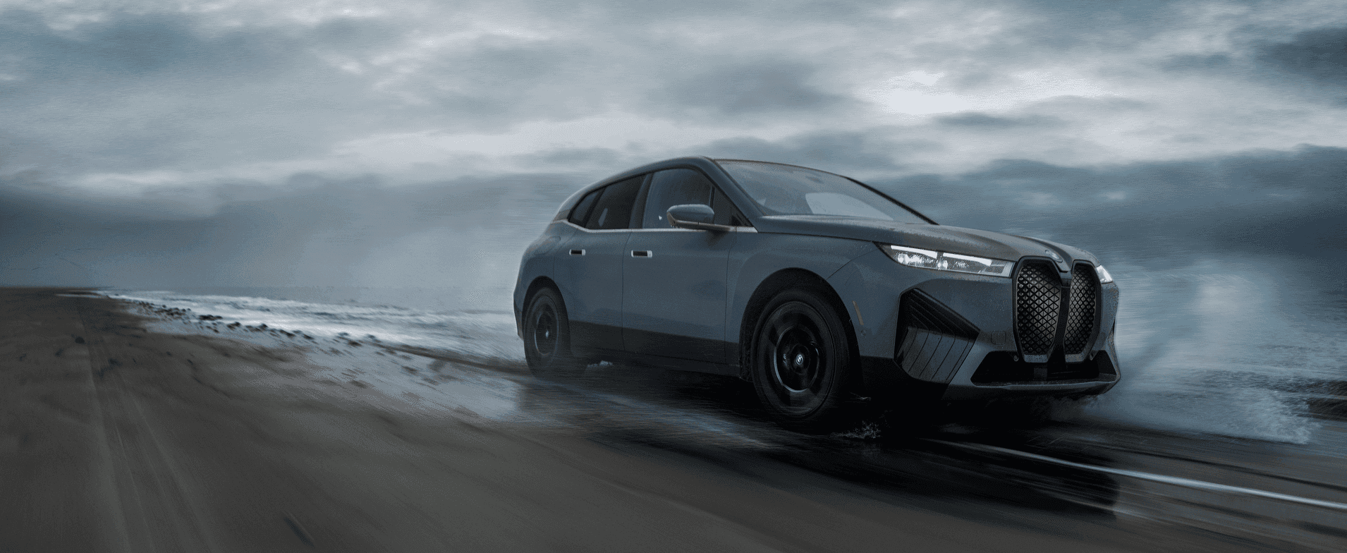 BMW iX parked in a scenic location