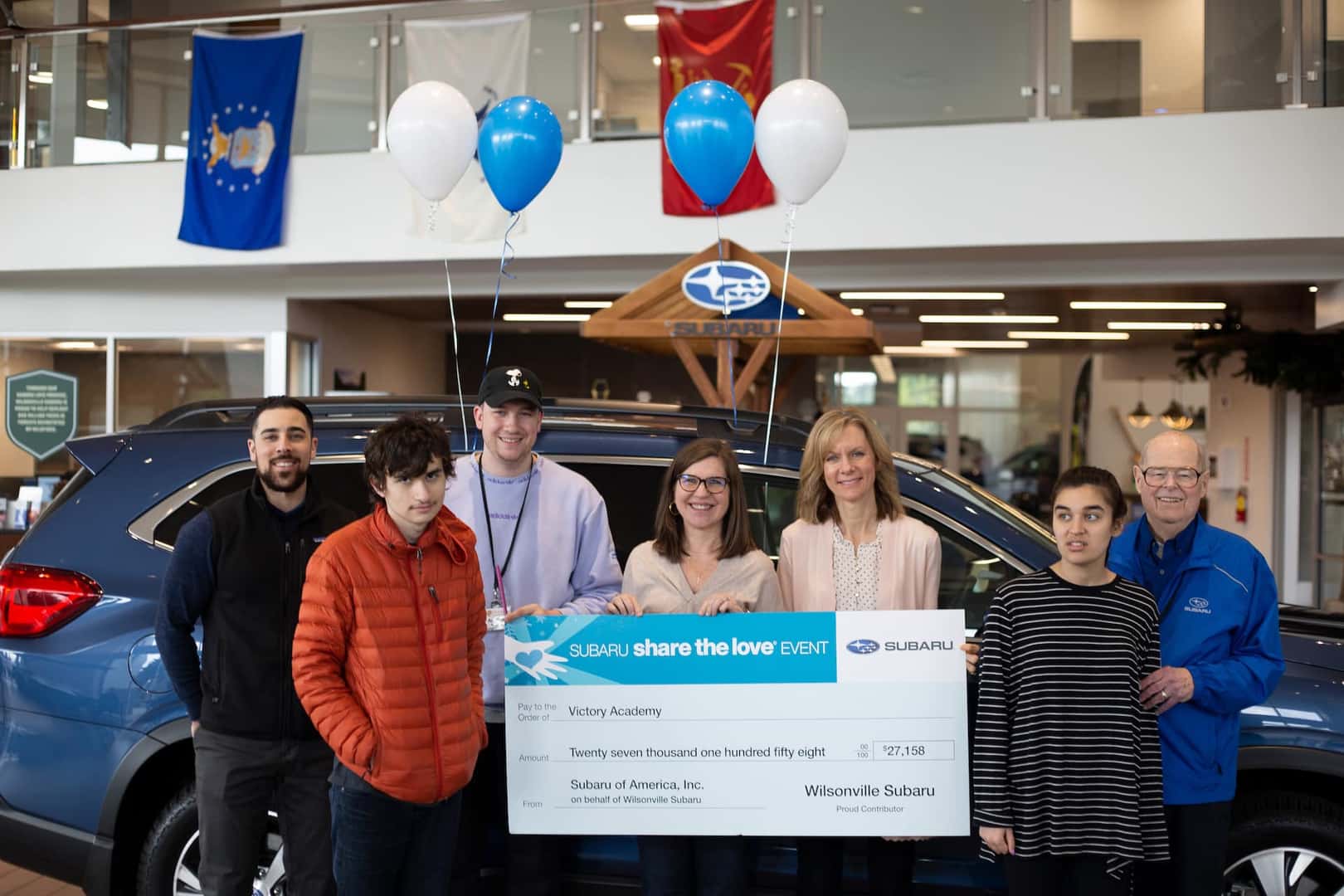 Wilsonville Subaru team presenting a Share the Love check