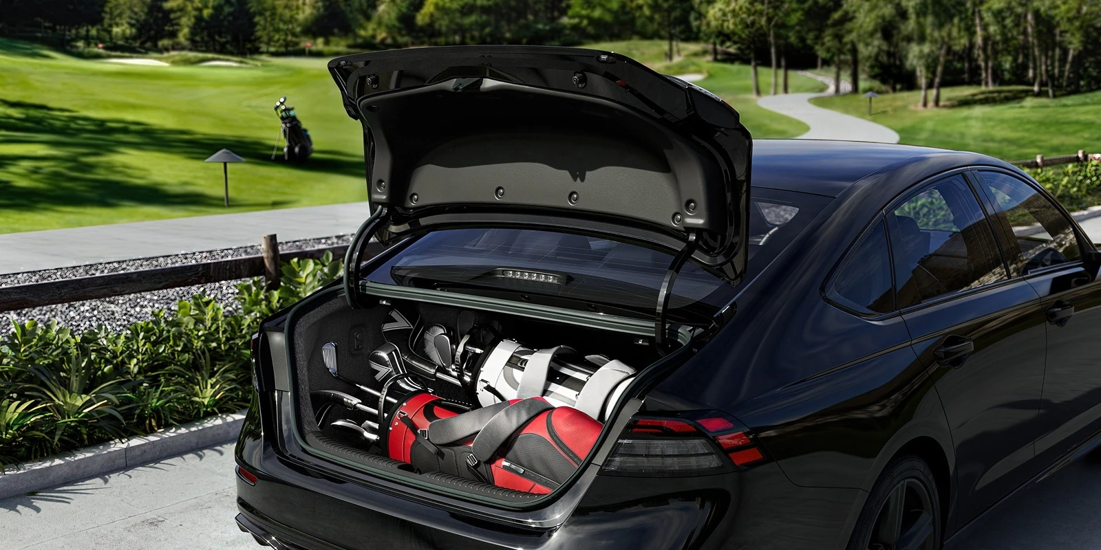 2026 Honda Accord trunk space loaded with two full sets of golf clubs in bags