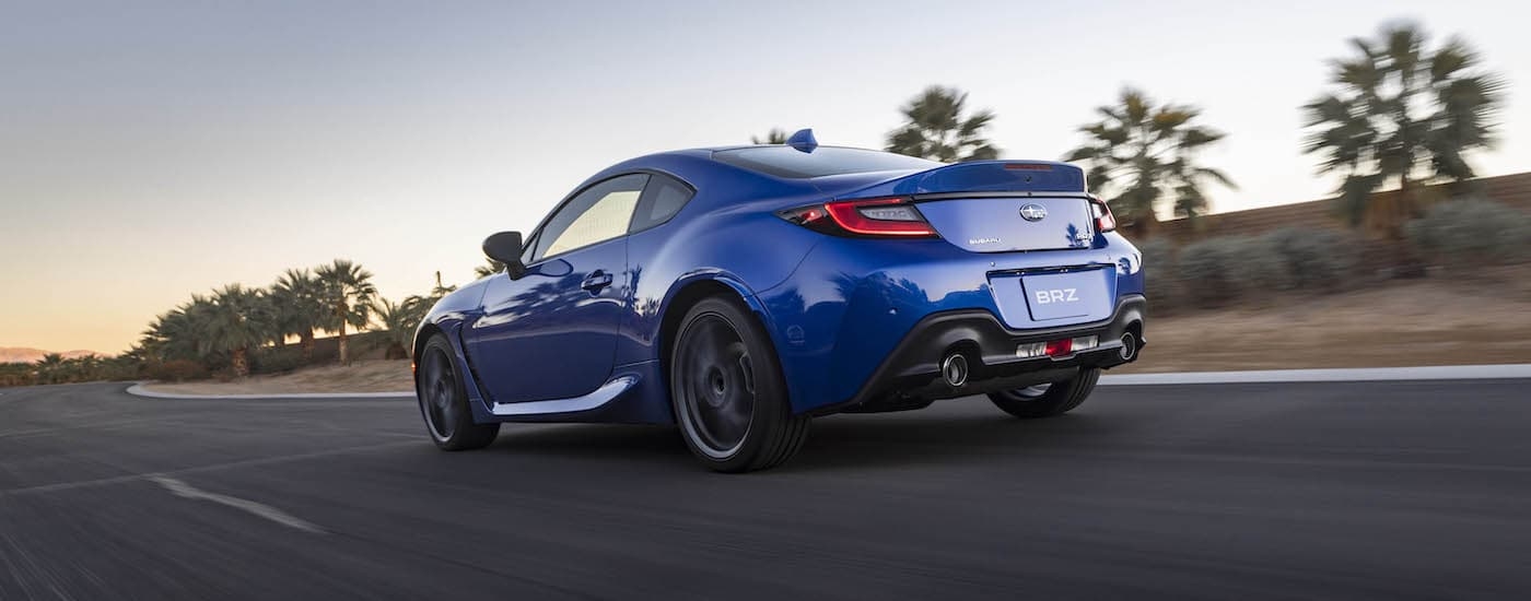 A blue 2025 Subaru BRZ from the rear at an angle.