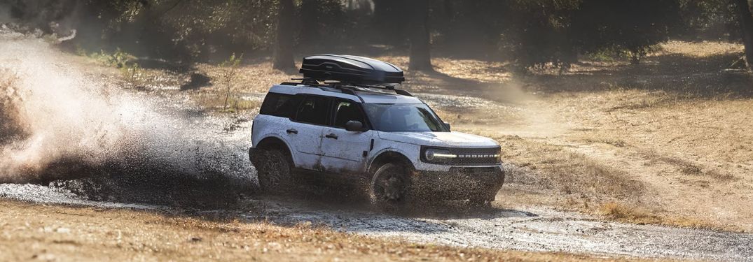 White 2025 Ford Bronco Sport Driving in the Mud