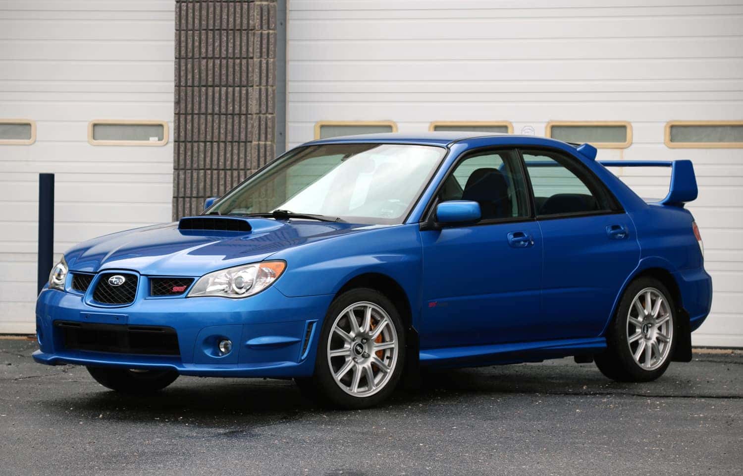 Blue Subaru Impreza WRX STI with hawk-eye headlights