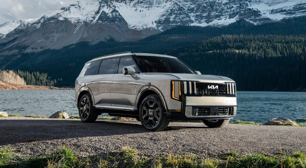 Silver 2027 Kia Telluride parked near a lake