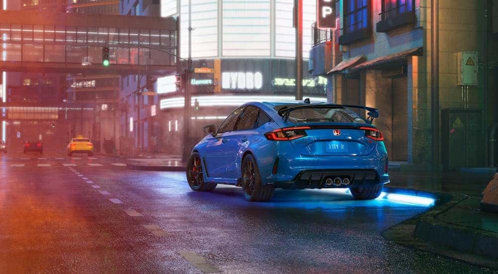 A blue 2025 Honda Civic Type R from the rear.