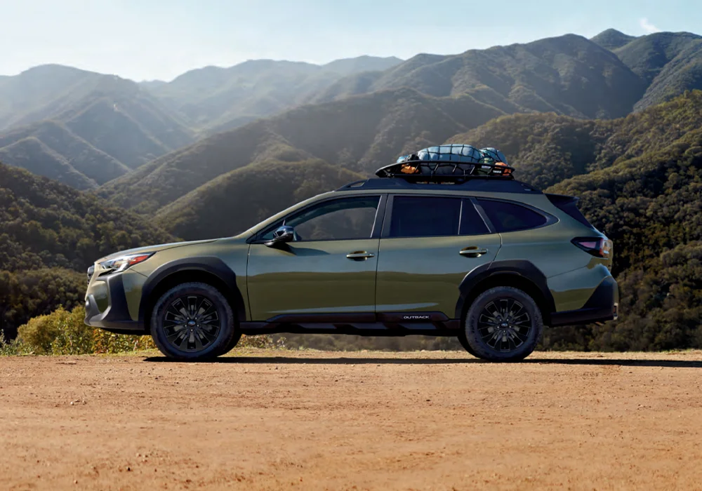 Subaru Outback parked near mountains