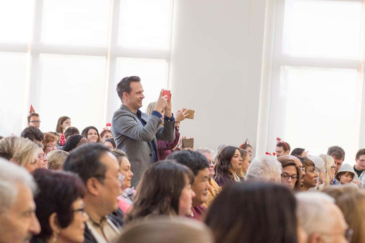 Audience applauding at a Victory Academy event