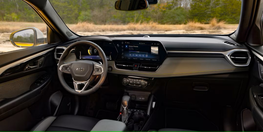 the front interior of a compact suv showing the head-up and infotainment system