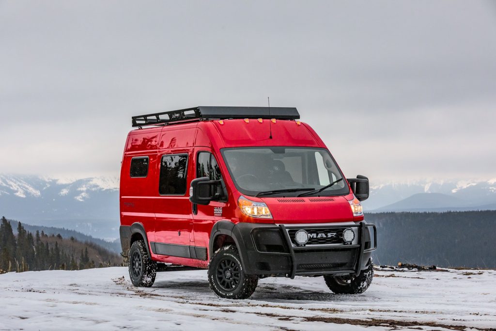 a red ram promaster sitting in a front passenger view in a tundra