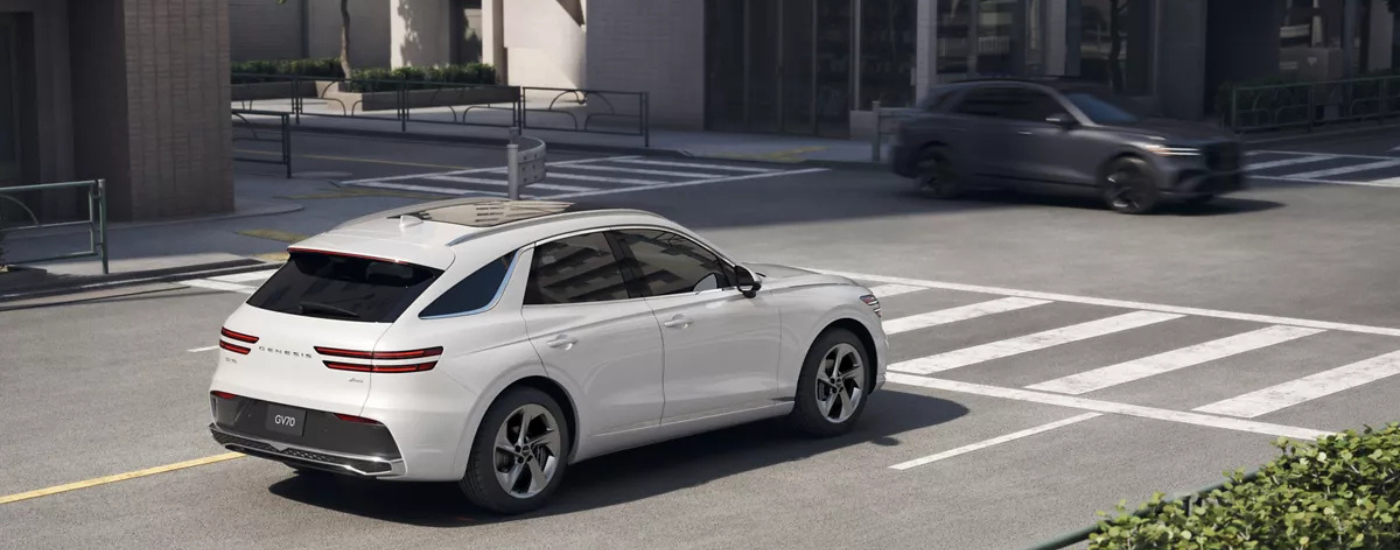 White 2026 Genesis GV70 at an intersection