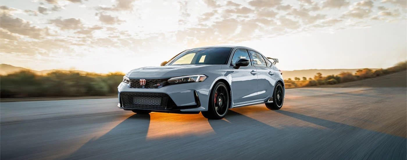 Grey 2024 Honda Civic Type R driving on a highway