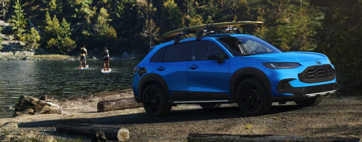 Blue 2026 Honda HR-V HPD parked near a lake