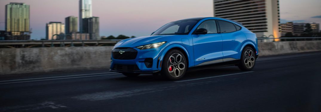 Blue 2024 Ford Mustang Mach-E Driving on a Freeway