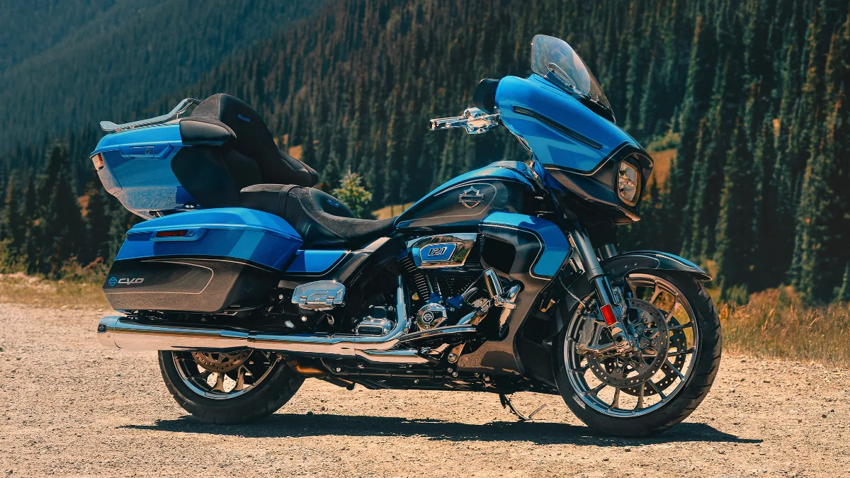 A new Harley Davidson street glide parked on a mountain side.