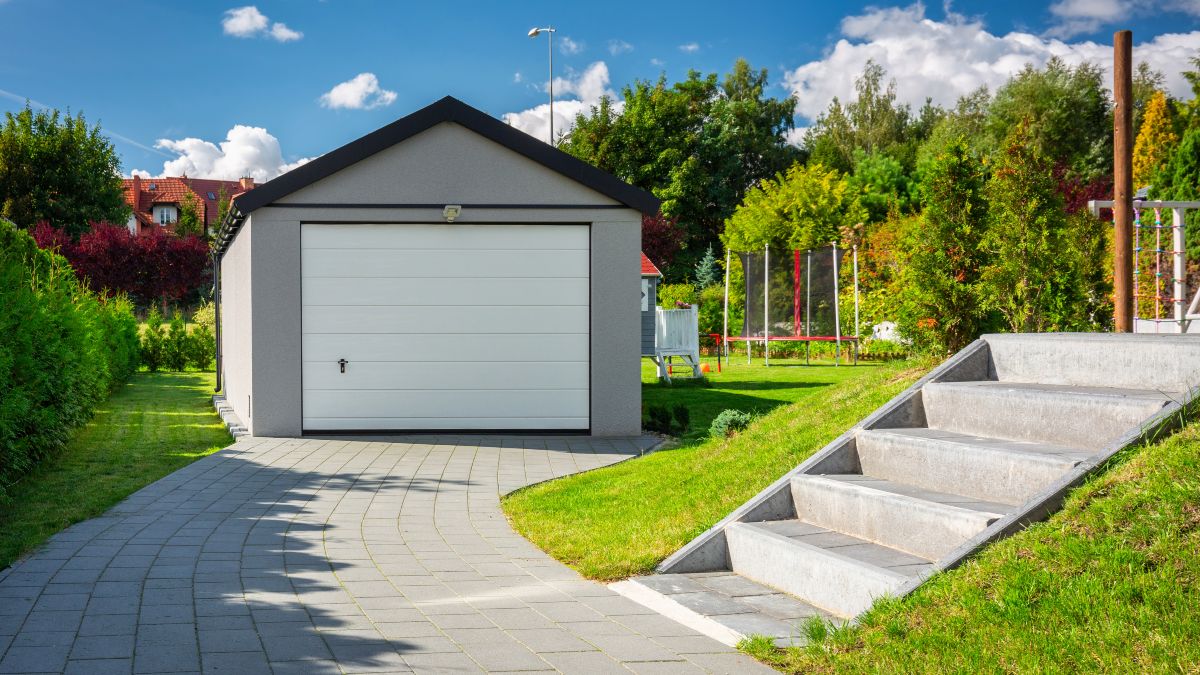 Detached Garage with Visible Driveway and Stairway
