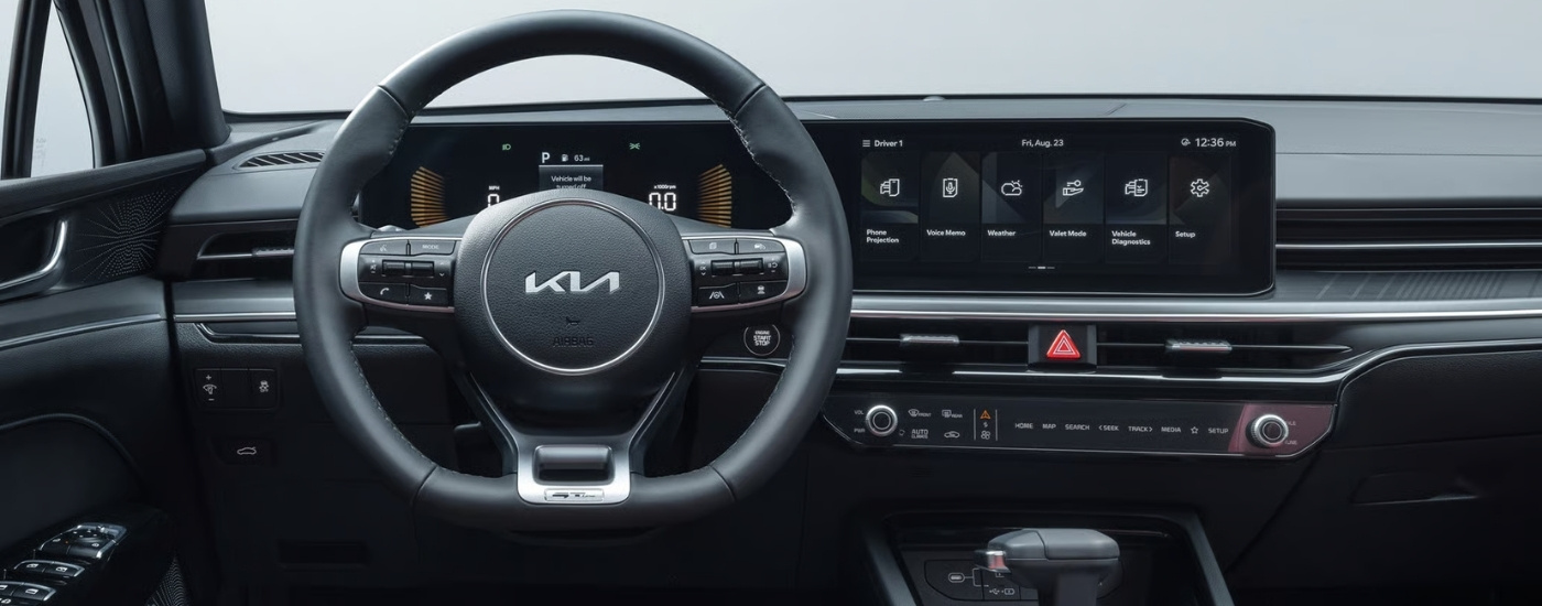 Steering wheel and dashboard in the interior of a 2025 Kia K5