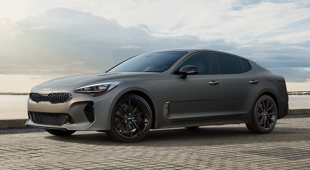 Grey 2023 Kia Stinger parked near a lake