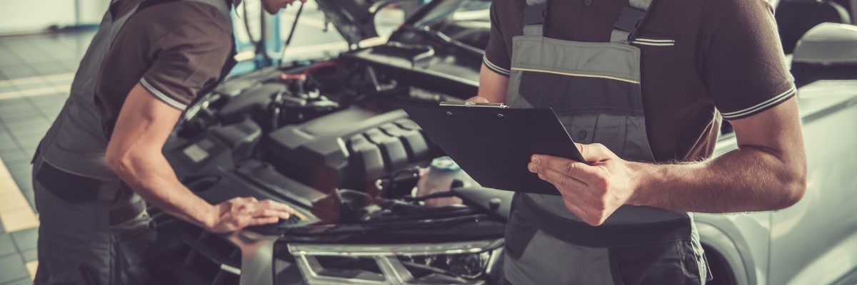 Service Technicians Checking Under Hood