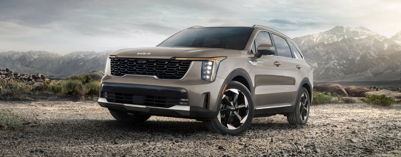 Tan 2025 Kia Sorento for sale near Bloomington PHEV parked off-road