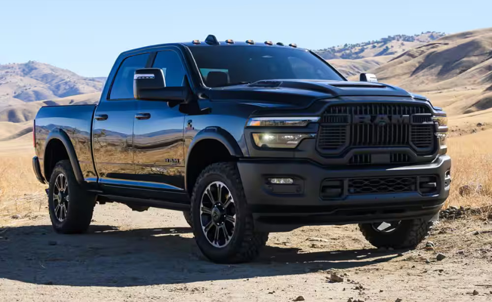 A black ram truck sitting parked.