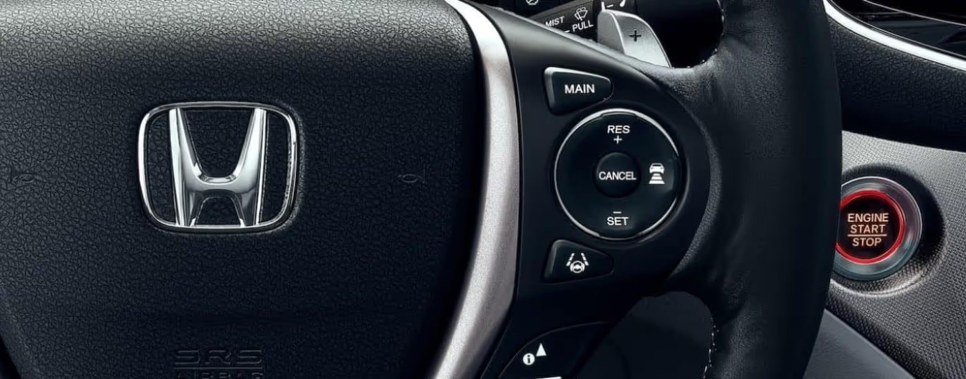 Close-up shows the steering wheel controls in a 2021 Honda Ridgeline RTL-E