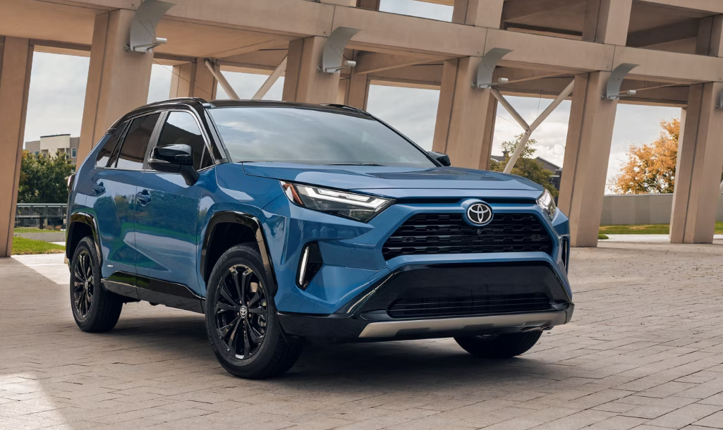 2025 Toyota RAV4 in blue paint style parked in a Kirksville, MO parking lot.
