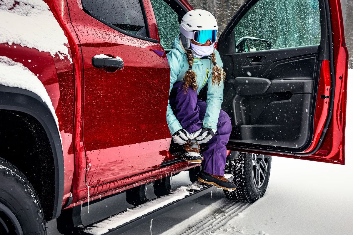 Woman Getting Out of Chevy Truck in the Snow